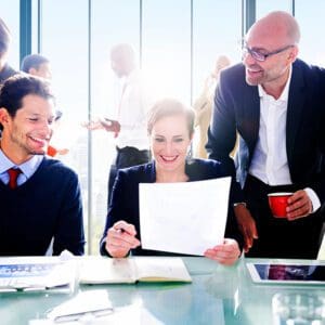 A group of people sitting around a table.
