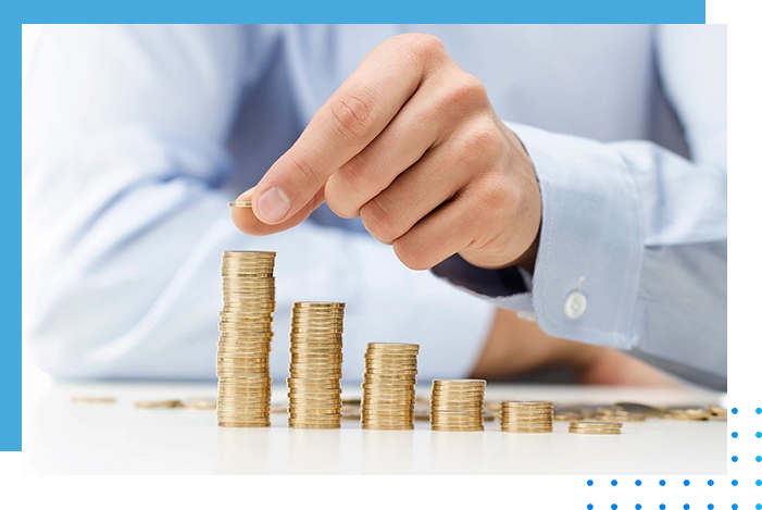 A person is putting money in piles of coins.