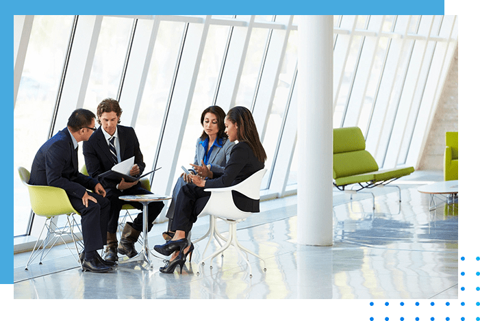 A group of people sitting around in an office.